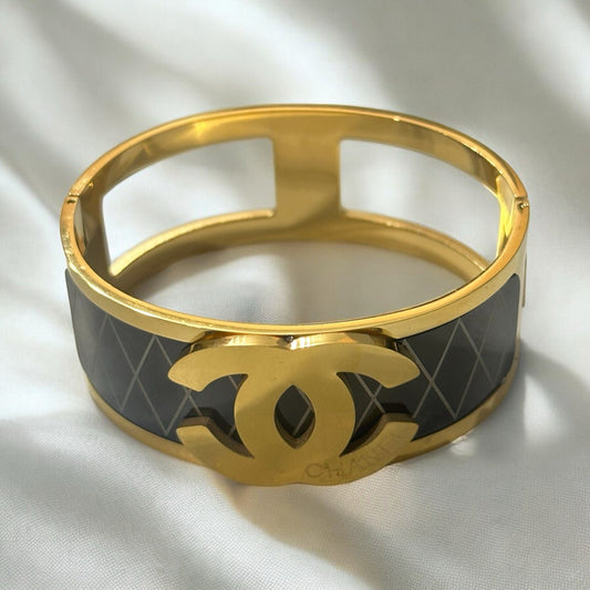 Luxe Harmony: Gold and Black Enamel Bracelet